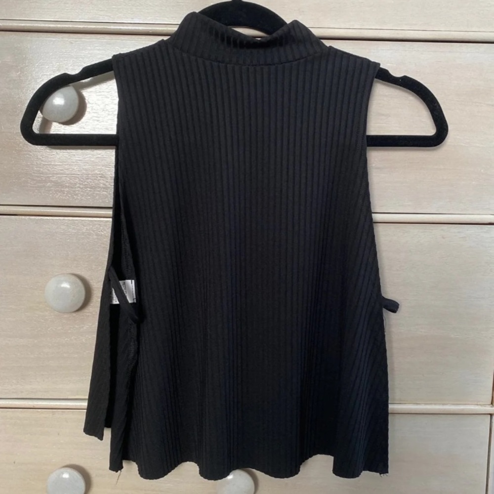 Black going out top
